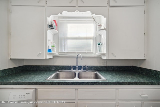 4125 Lowcroft Ave, Lansing, MI 48910 - kitchen with a sink, dark countertops, white dishwasher, and white cabinets