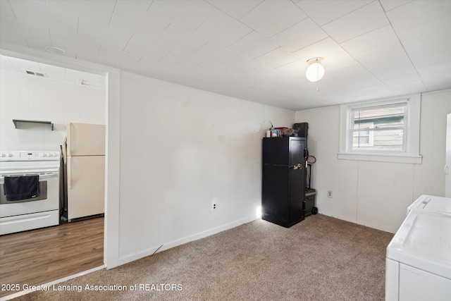4125 Lowcroft Ave, Lansing, MI 48910 - interior space featuring light carpet, laundry area, and visible vents