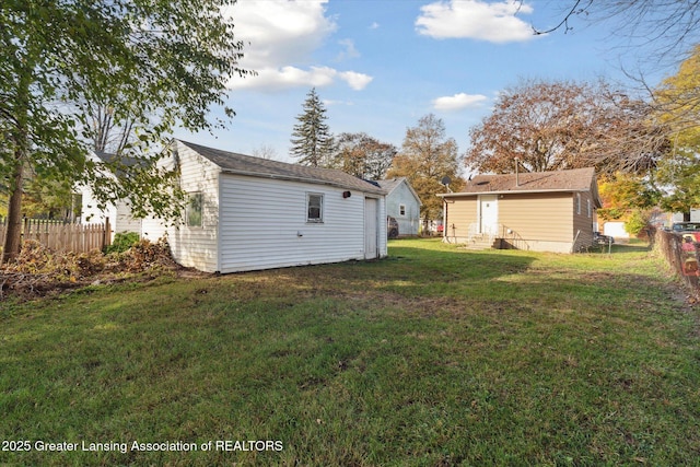 4125 Lowcroft Ave, Lansing, MI 48910 - view of yard with entry steps, an outdoor structure, and a fenced backyard