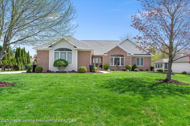 3012 Appaloosa Way, Lansing, MI 48906 - ranch-style house featuring a front lawn and brick siding