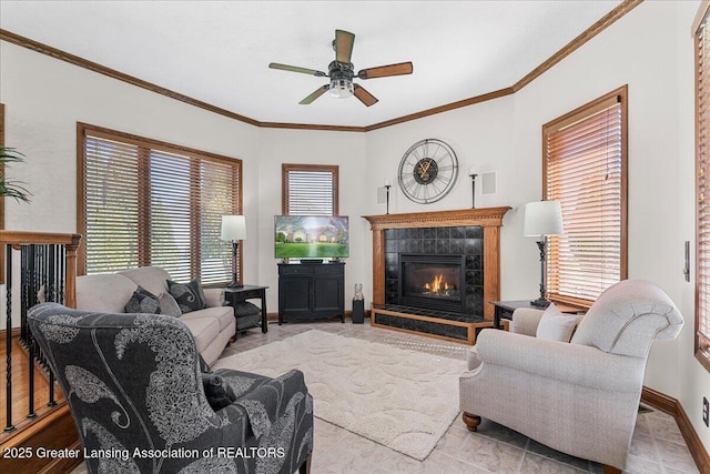 3012 Appaloosa Way, Lansing, MI 48906 - living area with a tiled fireplace, ornamental molding, ceiling fan, and a wealth of natural light