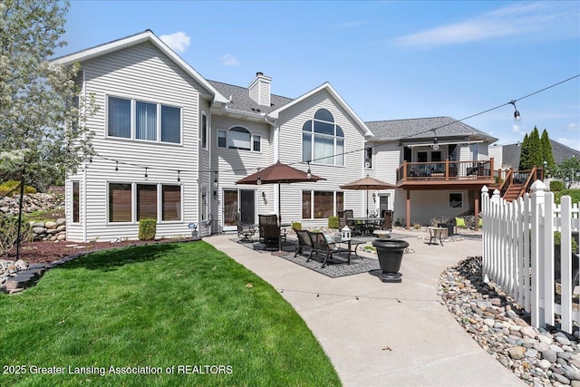3012 Appaloosa Way, Lansing, MI 48906 - rear view of property with a lawn, fence, a chimney, and a patio area