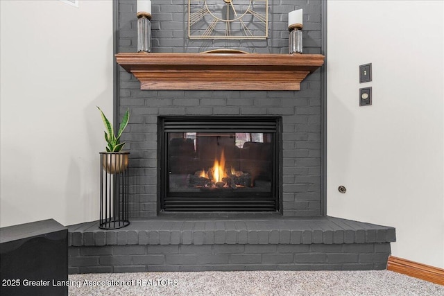 3012 Appaloosa Way, Lansing, MI 48906 - details featuring a fireplace