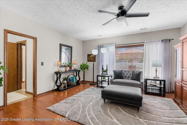 3012 Appaloosa Way, Lansing, MI 48906 - sitting room with a textured ceiling, a ceiling fan, baseboards, wood finished floors, and visible vents