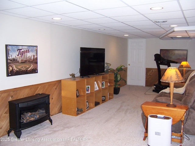 living room with carpet flooring and a drop ceiling