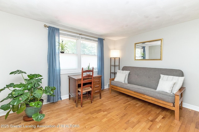 sitting room with light wood-style floors and baseboards