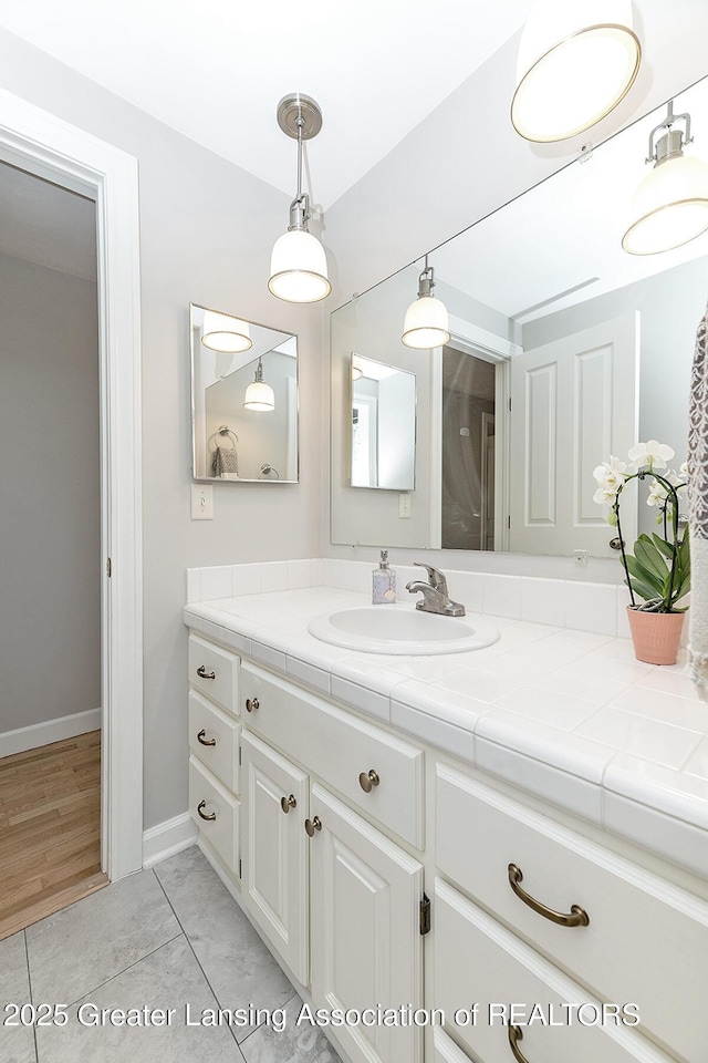 bathroom featuring vanity and baseboards