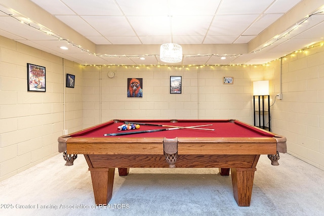 game room featuring billiards table, carpet floors, concrete block wall, and a paneled ceiling