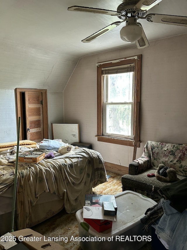 bedroom with a ceiling fan and vaulted ceiling