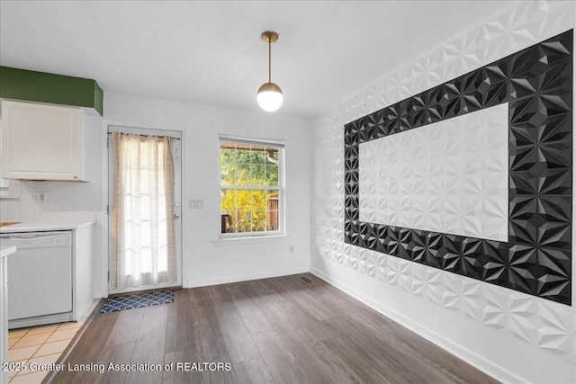 unfurnished dining area featuring light wood finished floors