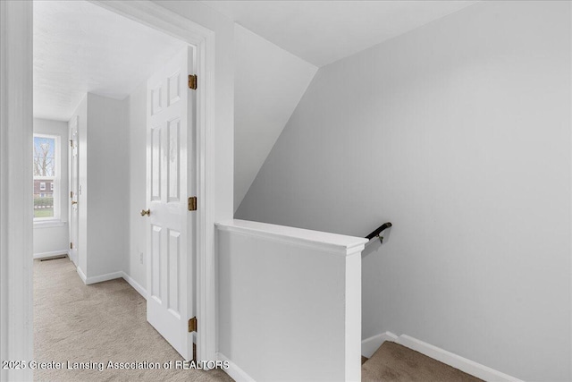staircase with carpet floors and baseboards