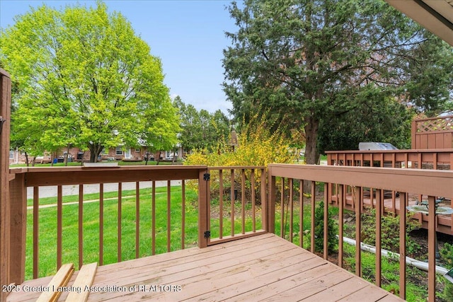 deck featuring a yard