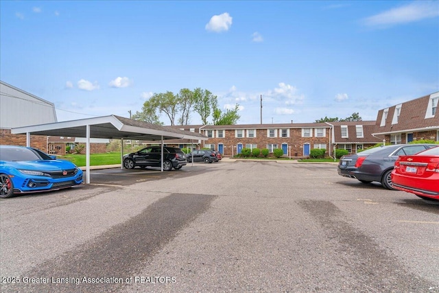 view of partially covered parking lot