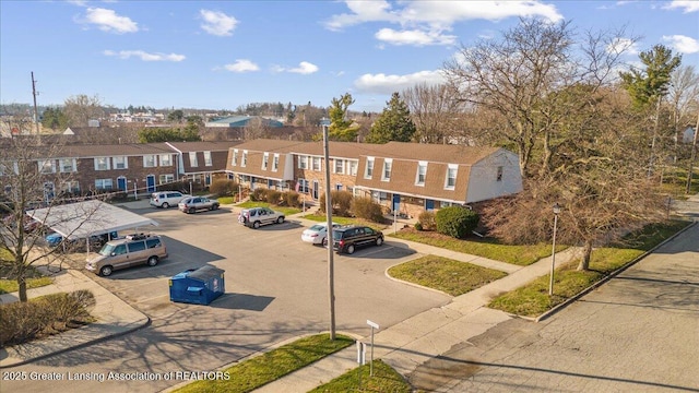 exterior space with uncovered parking and a residential view