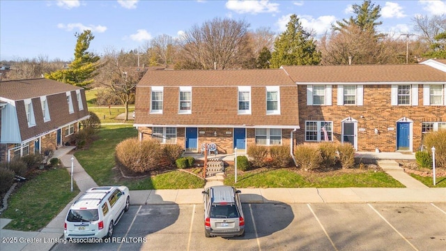 multi unit property featuring uncovered parking