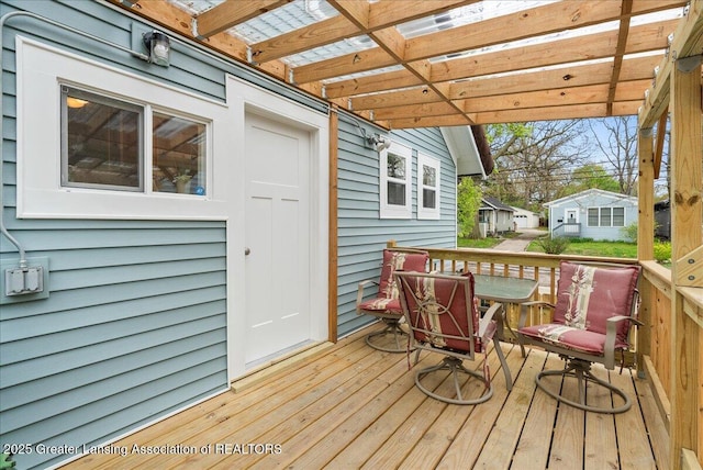 wooden deck featuring a pergola