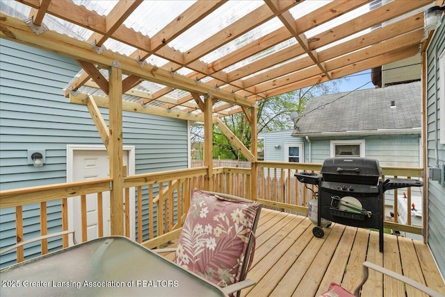 wooden deck featuring a pergola and grilling area