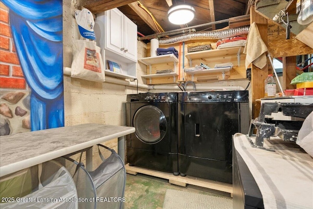 laundry room with cabinet space and washing machine and dryer