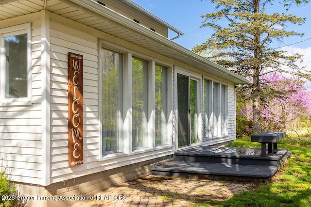 1061 E Sherwood Rd, Williamston, MI 48895 - view of side of property with a deck