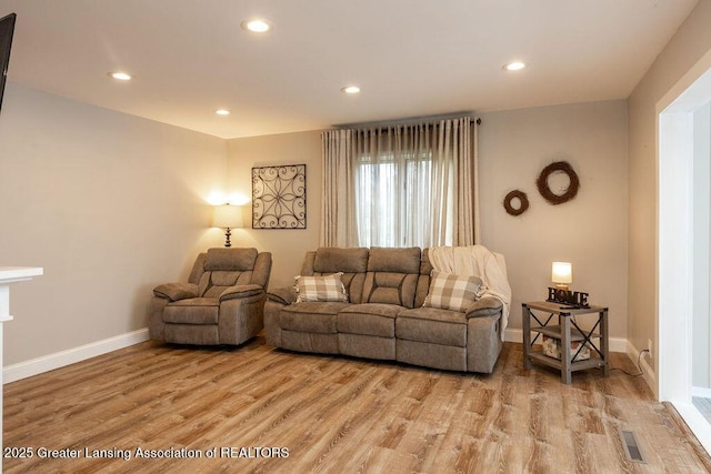 1061 E Sherwood Rd, Williamston, MI 48895 - living room with light wood-style floors, baseboards, and recessed lighting