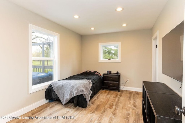 1061 E Sherwood Rd, Williamston, MI 48895 - bedroom featuring recessed lighting, baseboards, and light wood-style floors