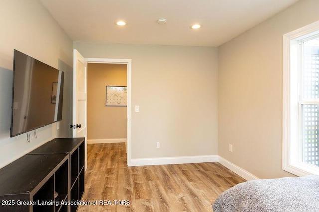 1061 E Sherwood Rd, Williamston, MI 48895 - bedroom with wood finished floors, recessed lighting, and baseboards