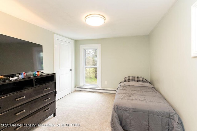 1061 E Sherwood Rd, Williamston, MI 48895 - bedroom with baseboard heating, light colored carpet, and baseboards