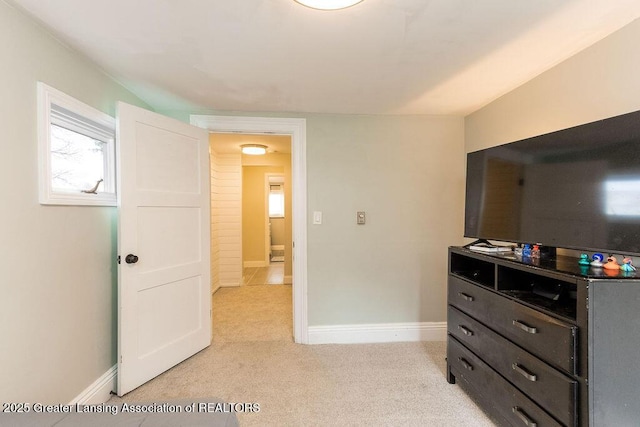1061 E Sherwood Rd, Williamston, MI 48895 - bedroom featuring light carpet and baseboards