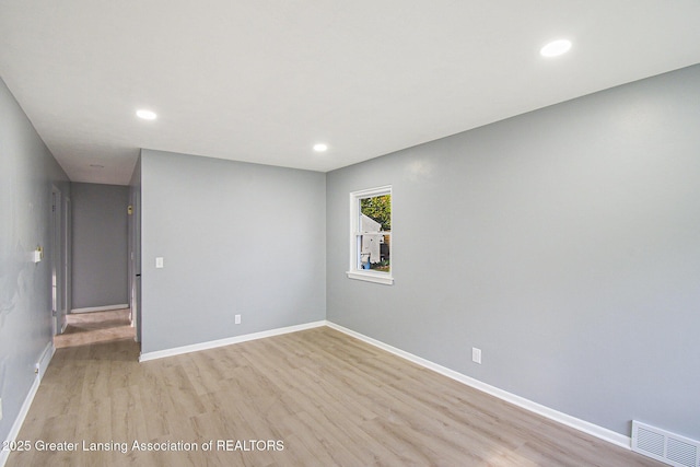spare room with recessed lighting, baseboards, visible vents, and light wood-style flooring