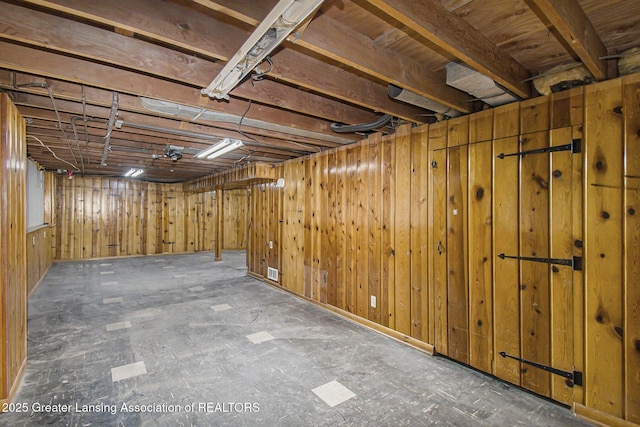 unfinished basement featuring visible vents