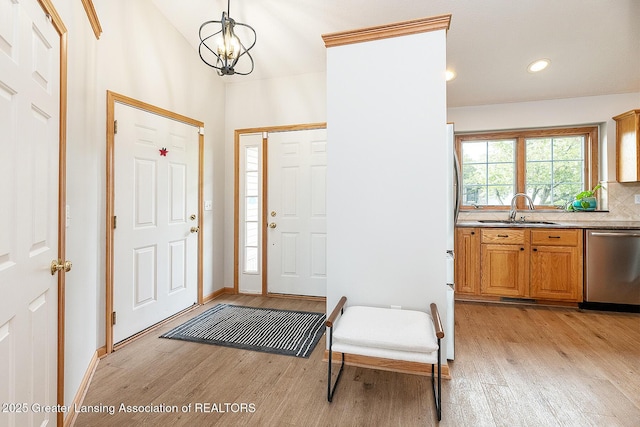 6032 Vienna Way, Lansing, MI 48917 - foyer with light wood-style floors, baseboards, recessed lighting, and a chandelier