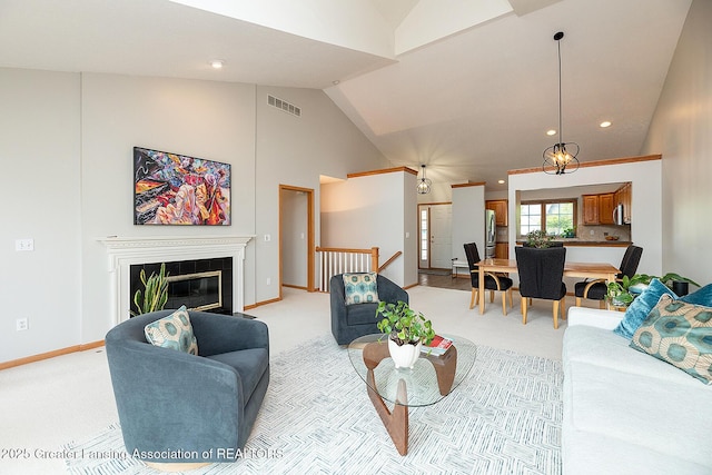 6032 Vienna Way, Lansing, MI 48917 - living room with visible vents, a glass covered fireplace, baseboards, recessed lighting, and light colored carpet