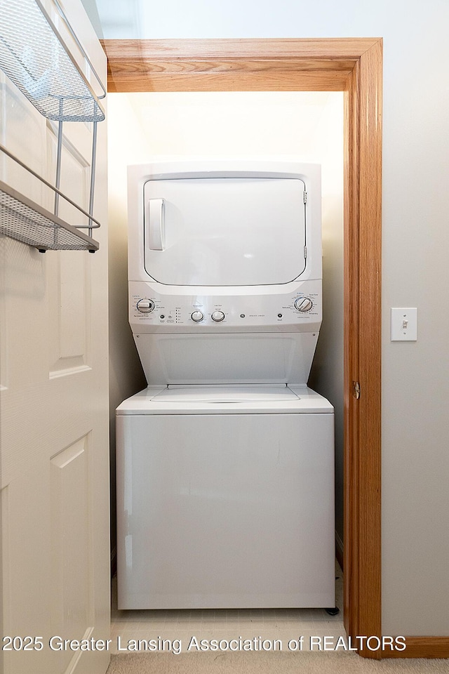 6032 Vienna Way, Lansing, MI 48917 - washroom with stacked washer / drying machine and laundry area