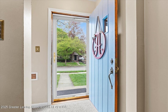 foyer featuring baseboards