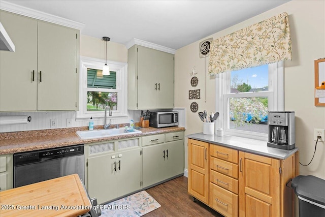 kitchen with a sink, stainless steel microwave, black dishwasher, dark wood finished floors, and light countertops