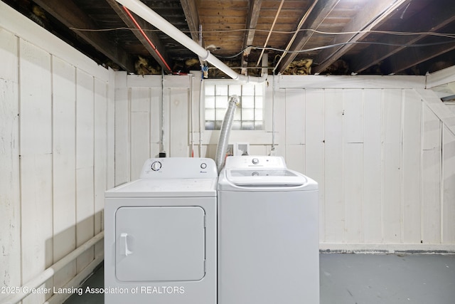 washroom featuring washer and clothes dryer and laundry area