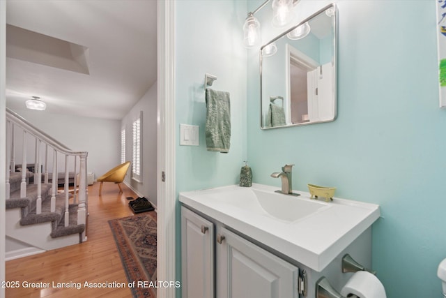 1212 Sandhill Dr, Dewitt, MI 48820 - half bathroom featuring vanity and wood finished floors