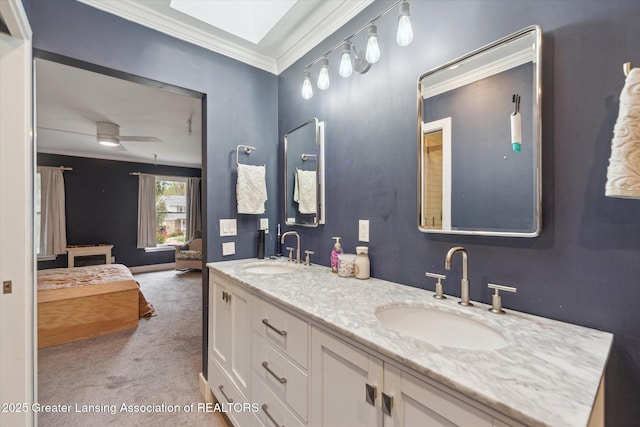 1212 Sandhill Dr, Dewitt, MI 48820 - ensuite bathroom featuring a sink, double vanity, ornamental molding, and ceiling fan