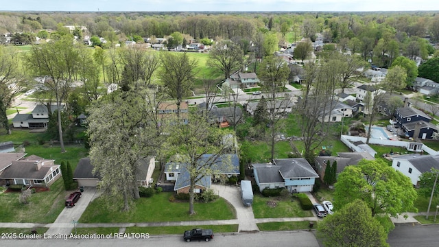 bird's eye view featuring a view of trees and a residential view