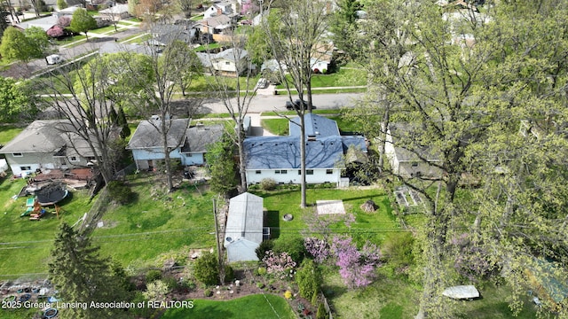 birds eye view of property with a residential view