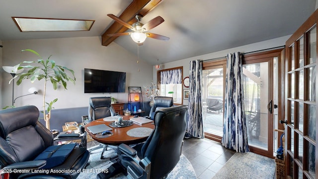 dining room with a ceiling fan, lofted ceiling with beams, and tile patterned floors