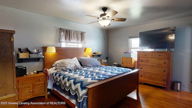 bedroom featuring ceiling fan and wood finished floors