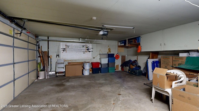 garage featuring a garage door opener