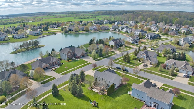 birds eye view of property featuring a water view and a residential view