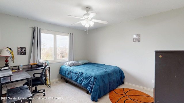 bedroom featuring baseboards, a ceiling fan, and carpet floors