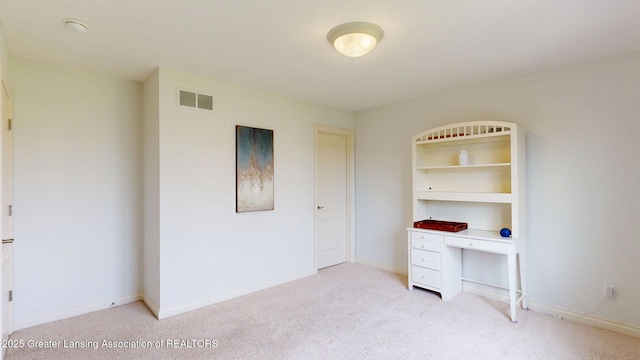 unfurnished bedroom featuring light carpet, baseboards, and visible vents