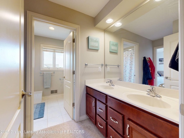 full bathroom with recessed lighting, visible vents, a sink, and double vanity