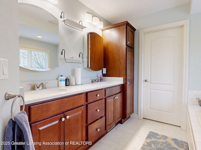 full bath with tile patterned flooring, double vanity, and a sink