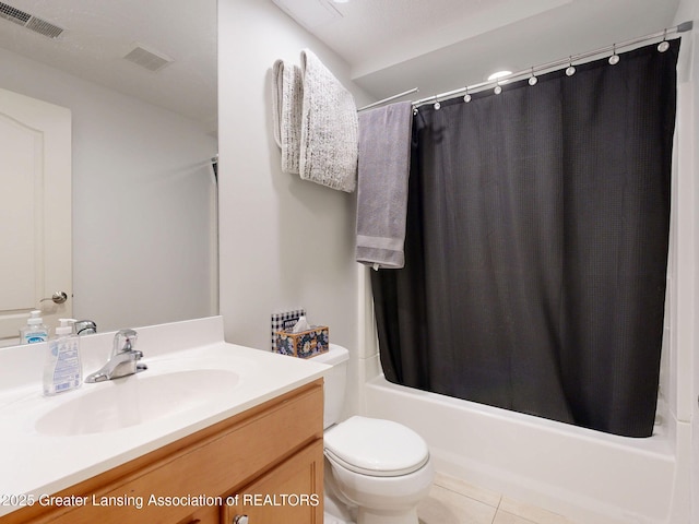 full bathroom featuring toilet, vanity, visible vents, tile patterned floors, and shower / bath combo