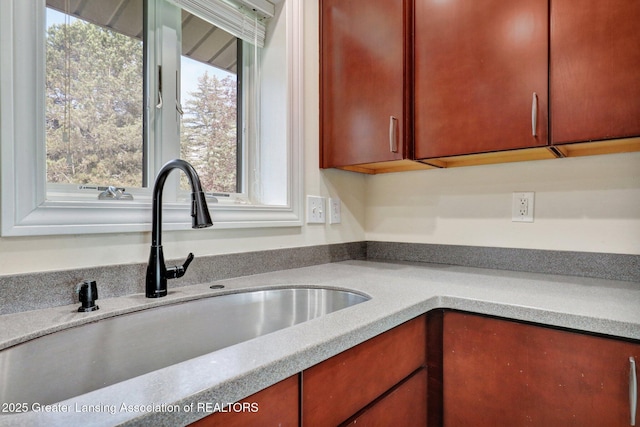 kitchen with light countertops and a sink